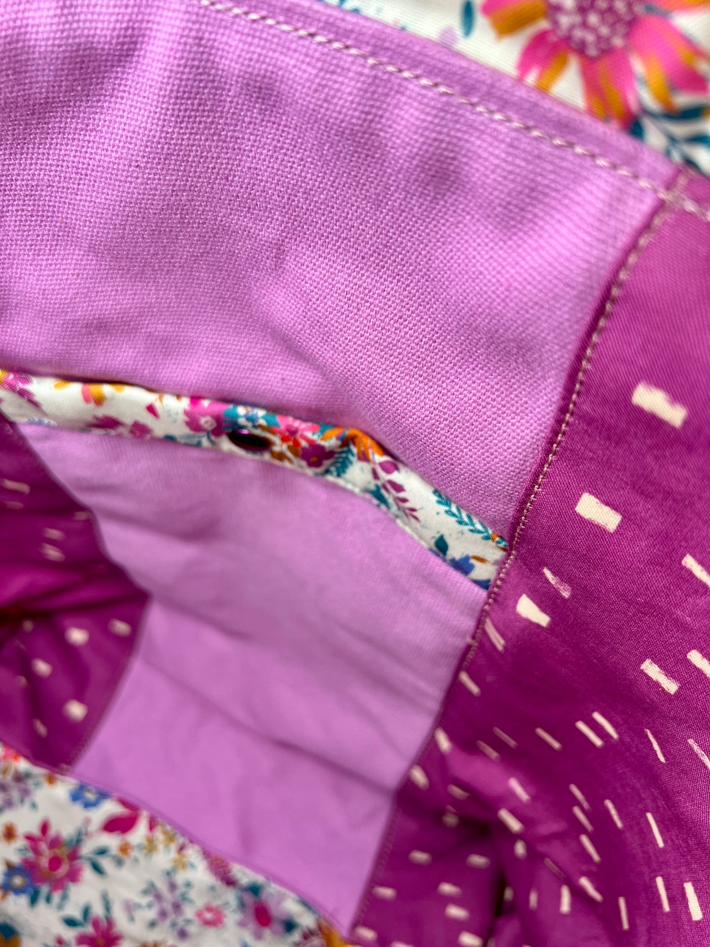 Close-up of a interior of bag showing deep snap pocket.